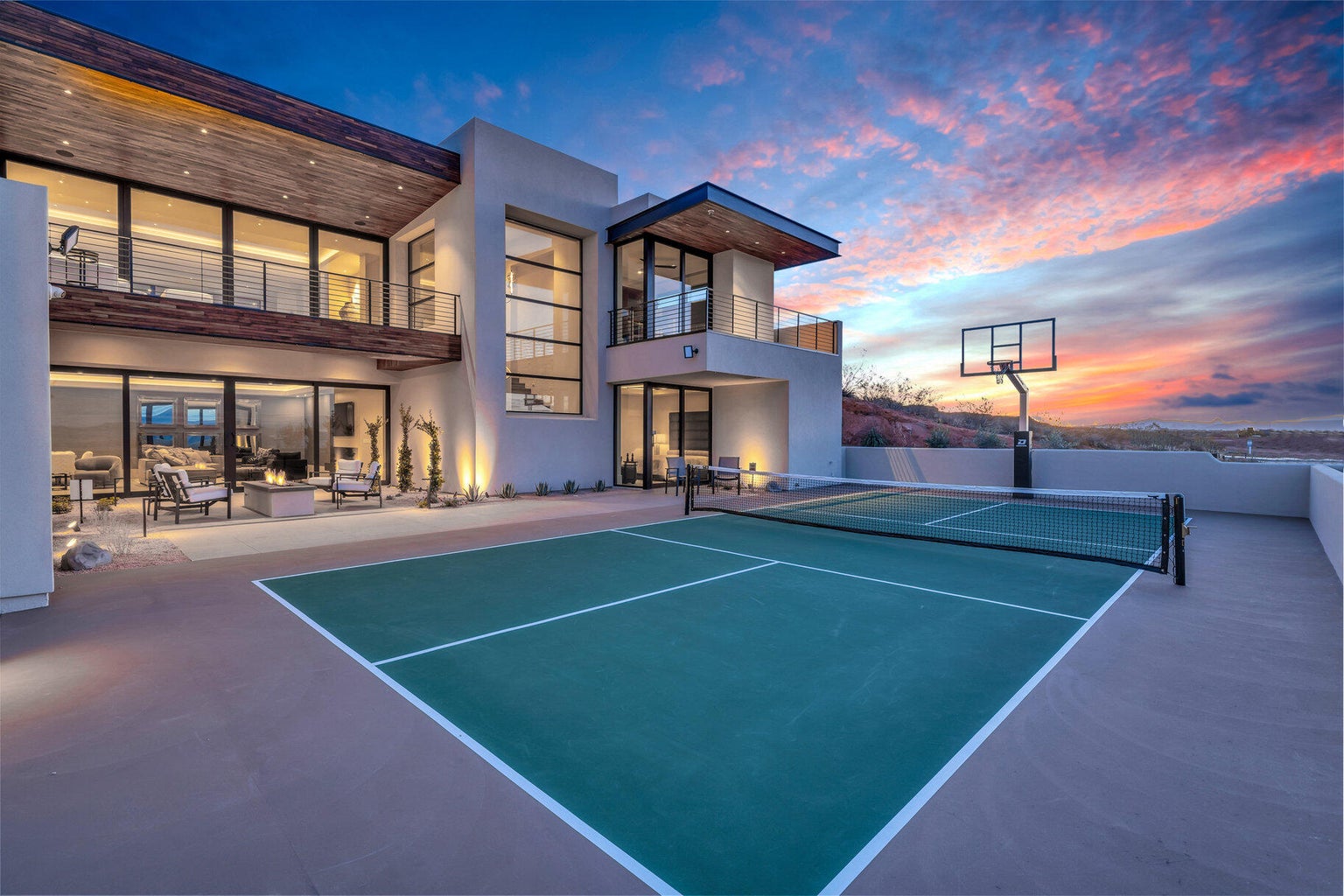 tennis court with basketball hoop