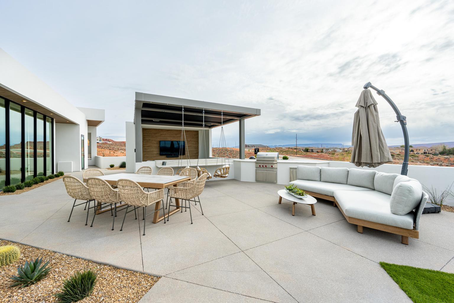 outdoor patio with couch, tables, and covered area